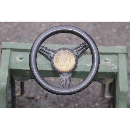 585 - VINTAGE GREEN PAINTED WOODEN JEEP BUDDYL WHEELS SIT IN TOY CAR