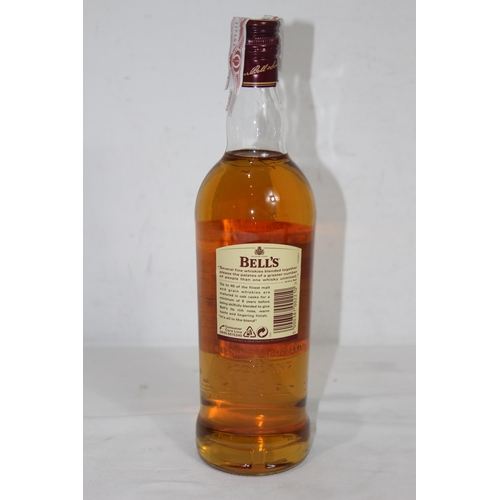 604 - I LITRE BOTTLE OF BELLS WHISKEY