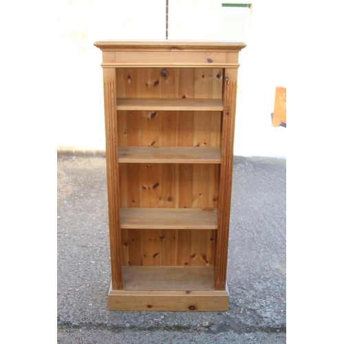 56 - NATURAL PINE BOOKCASE
67 X 30 X 139CM