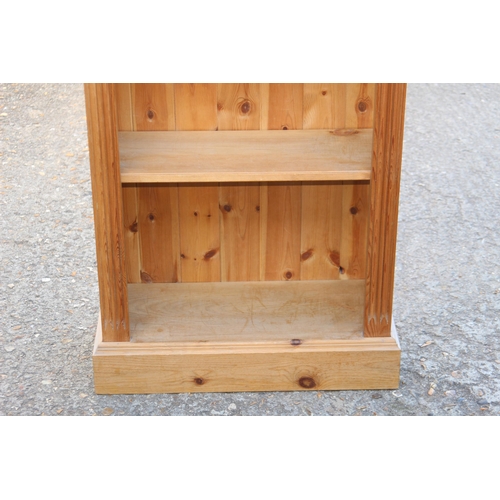 56 - NATURAL PINE BOOKCASE
67 X 30 X 139CM