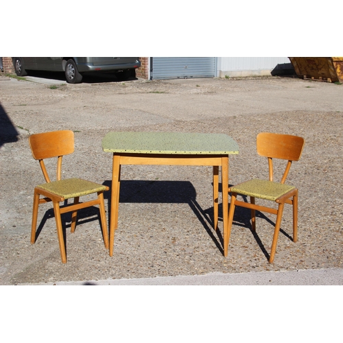 63 - 60s GUILDFORM DINING TABLE AND TWO CHAIRS 
90 X 60 X 75CM