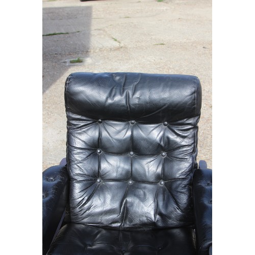 68 - PAIR OF RETRO EKORNES BLACK LEATHER CHAIRS AND FOOTSTOOLS 
80 X 72 X 98CM