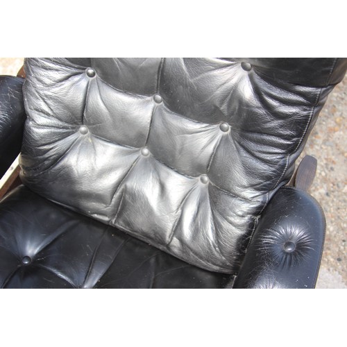 68 - PAIR OF RETRO EKORNES BLACK LEATHER CHAIRS AND FOOTSTOOLS 
80 X 72 X 98CM