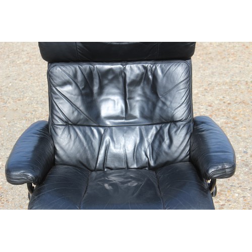 69 - EKORNES BLACK LEATHER RECLINING STRESSLESS CHAIR AND FOOT STOOL 
84 X 70 X 102CM