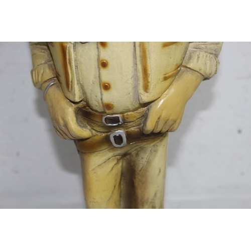 307 - JOHN WAYNE FIGURE, BUST OF BUFFALO BILL AND A CERAMIC COWBOY BOOT
45CM