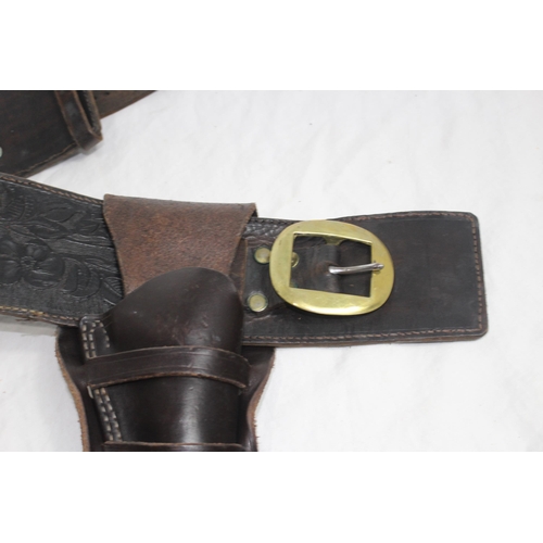 309 - 2 X LEATHER COWBOY BELTS AND HOLSTERS ETC