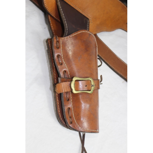 309 - 2 X LEATHER COWBOY BELTS AND HOLSTERS ETC