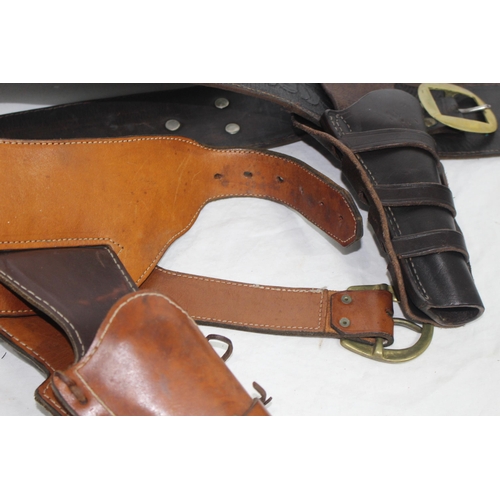 309 - 2 X LEATHER COWBOY BELTS AND HOLSTERS ETC