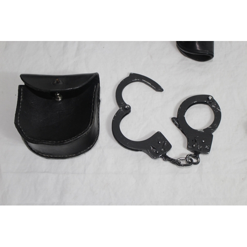 354 - QUANTITY OF HOLSTERS, HANDCUFFS ETC