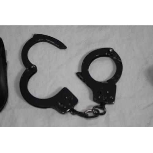 354 - QUANTITY OF HOLSTERS, HANDCUFFS ETC