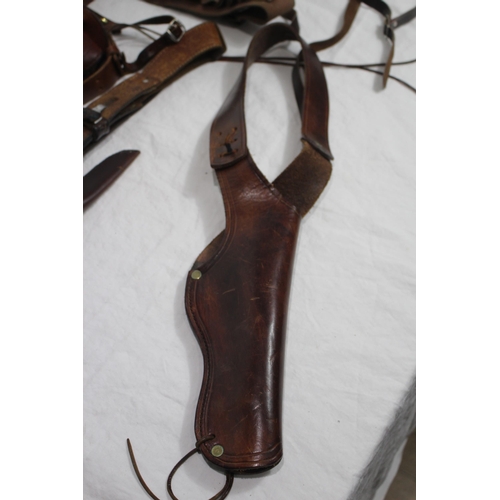 356 - QUANTITY OF BROWN LEATHER GUN HOLSTERS ETC