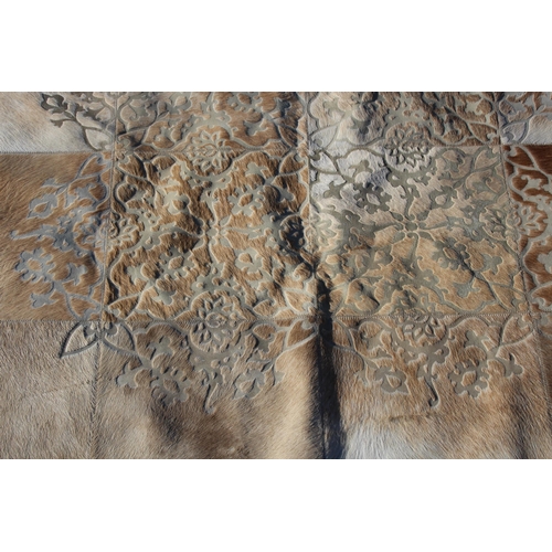 220 - EMBOSSED REAL HIDE WALL HANGING 
147 X 119CM