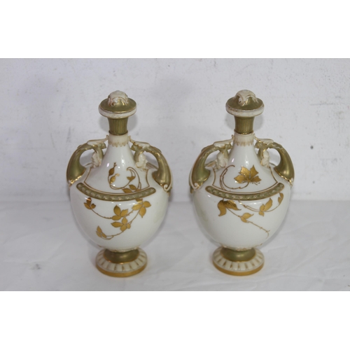 264 - PAIR OF ROYAL WORCESTER LIDDED URNS 
20CM