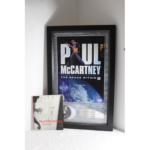 181 - PAUL McCARTNEY THE SPACE WITHIN US MEMROBILLIA FRAME WITH BOOK 
84 X 54CM