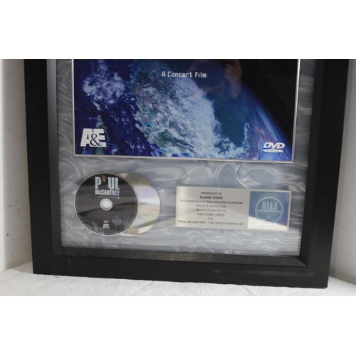 181 - PAUL McCARTNEY THE SPACE WITHIN US MEMROBILLIA FRAME WITH BOOK 
84 X 54CM