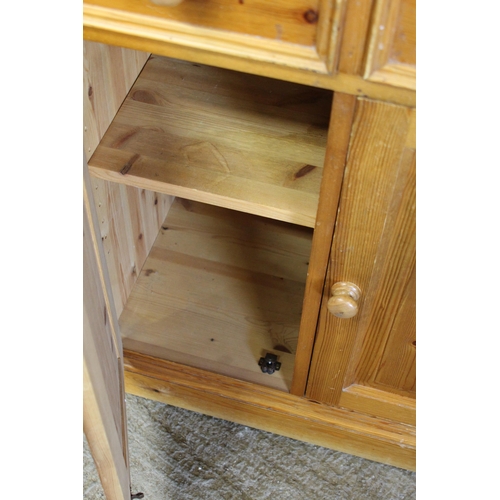 31 - TWO DOOR PINE DRESSER 
65 X 45 X 200CM