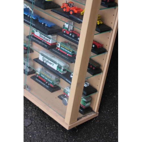 598 - LARGE DISPLAY CABINET WITH EDDIE STOBART TRUCKS  x30
65 X 19 X 113CM