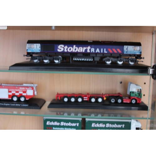 598 - LARGE DISPLAY CABINET WITH EDDIE STOBART TRUCKS  x30
65 X 19 X 113CM