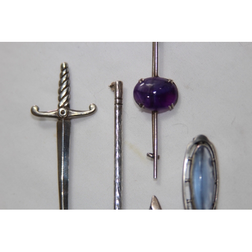 925 - FOUR SILVER BROOCHES, CELTIC SWORD, AXE AND TWO STONE SET