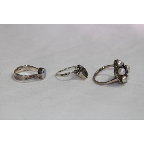 950 - THREE SILVER RINGS ONE SET WITH AN OPAL