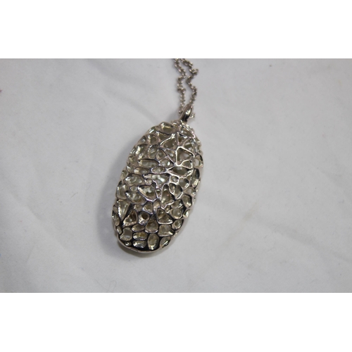 951 - VERY LARGE SILVER PENDANT NECKLACE OF PIERCED OVAL DESIGNS