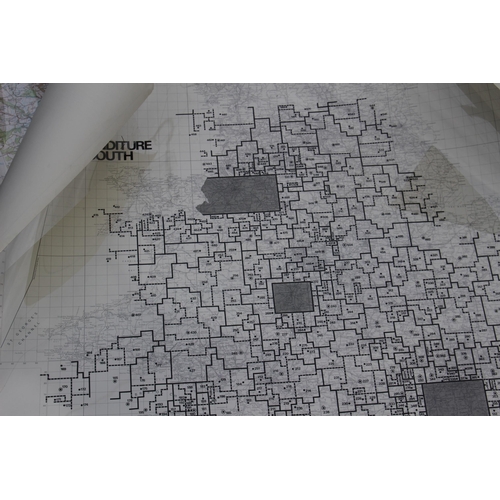 192 - LARGE QUANTITY OF ROLLED MAPS, SOME WITH CELLOPHANE GRID OVERLAY