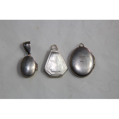 936 - FOUR SILVER LOCKET PENDANTS