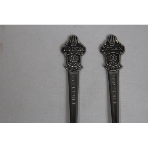 857 - PAIR OF ROLEX COMEMMORATIVE SPOONS