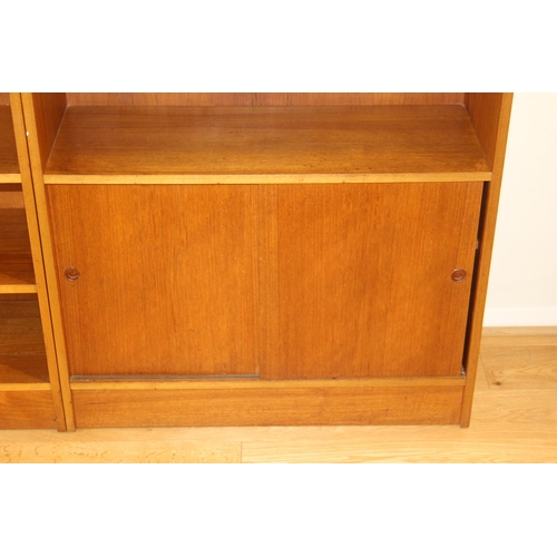 24 - THREE 1970'S TEAK WALL UNITS 
48 X 38 X 104
233 ALTOGETHER