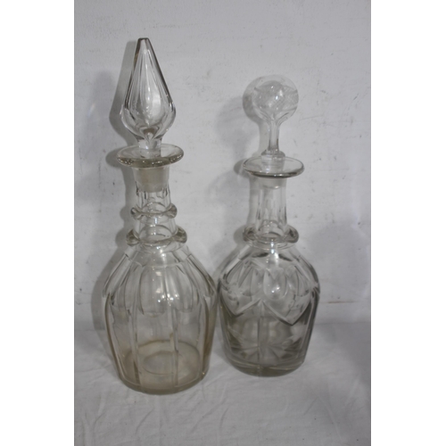 283 - FLAT BOTTOM SHIP DECANTER AND SIX OTHER DECANTERS ALL WITH STOPPERS x7