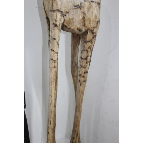 293 - LARGE CARVED WOODEN GIRAFFE AND A SELECTION OF AFRICAN WOODEN PIECES
106CM