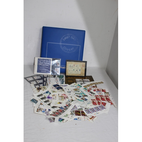 295 - AN ALBUM OF 1ST DAY COVERS AND A LARGE QUANTITY OF UNUSED BRITISH STAMPS IN EXCESS OF £40