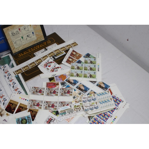 295 - AN ALBUM OF 1ST DAY COVERS AND A LARGE QUANTITY OF UNUSED BRITISH STAMPS IN EXCESS OF £40