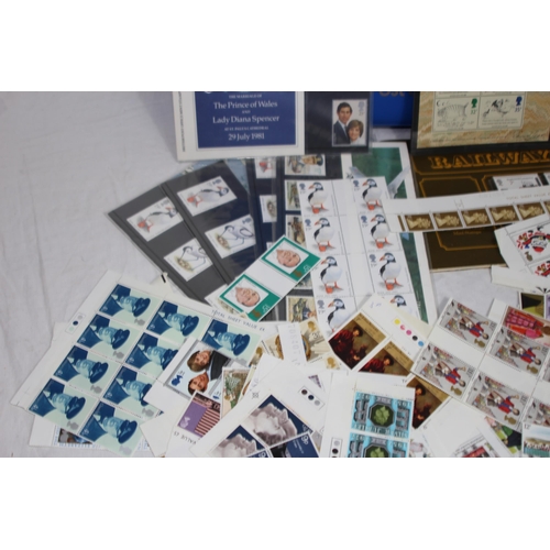 295 - AN ALBUM OF 1ST DAY COVERS AND A LARGE QUANTITY OF UNUSED BRITISH STAMPS IN EXCESS OF £40