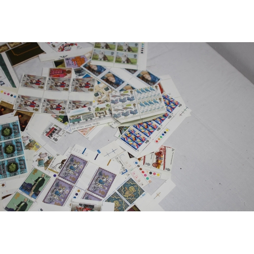 295 - AN ALBUM OF 1ST DAY COVERS AND A LARGE QUANTITY OF UNUSED BRITISH STAMPS IN EXCESS OF £40