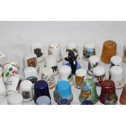 202 - COLLECTION OF OVER 600 CERAMIC, METAL AND WOODEN DECORATIVE THIMBLES