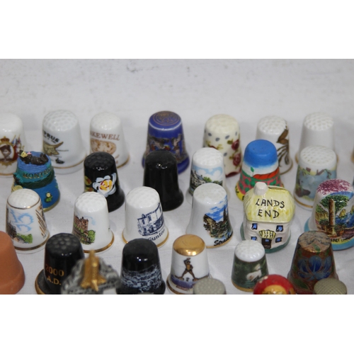 202 - COLLECTION OF OVER 600 CERAMIC, METAL AND WOODEN DECORATIVE THIMBLES