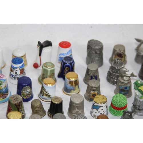 202 - COLLECTION OF OVER 600 CERAMIC, METAL AND WOODEN DECORATIVE THIMBLES