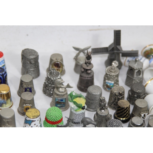 202 - COLLECTION OF OVER 600 CERAMIC, METAL AND WOODEN DECORATIVE THIMBLES