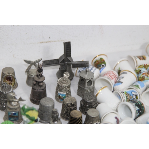 202 - COLLECTION OF OVER 600 CERAMIC, METAL AND WOODEN DECORATIVE THIMBLES