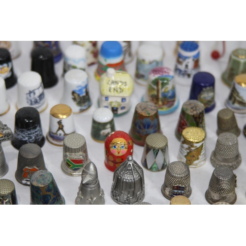 202 - COLLECTION OF OVER 600 CERAMIC, METAL AND WOODEN DECORATIVE THIMBLES