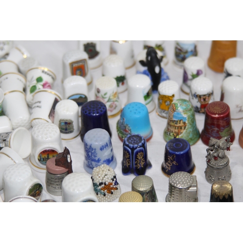 202 - COLLECTION OF OVER 600 CERAMIC, METAL AND WOODEN DECORATIVE THIMBLES