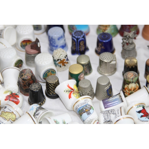 202 - COLLECTION OF OVER 600 CERAMIC, METAL AND WOODEN DECORATIVE THIMBLES