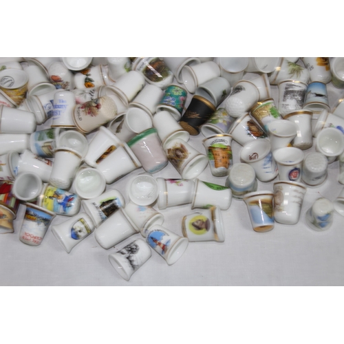 202 - COLLECTION OF OVER 600 CERAMIC, METAL AND WOODEN DECORATIVE THIMBLES