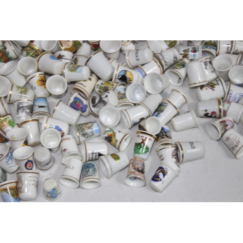 202 - COLLECTION OF OVER 600 CERAMIC, METAL AND WOODEN DECORATIVE THIMBLES