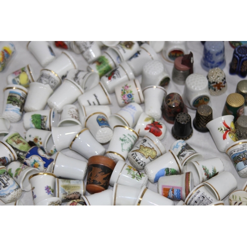 202 - COLLECTION OF OVER 600 CERAMIC, METAL AND WOODEN DECORATIVE THIMBLES