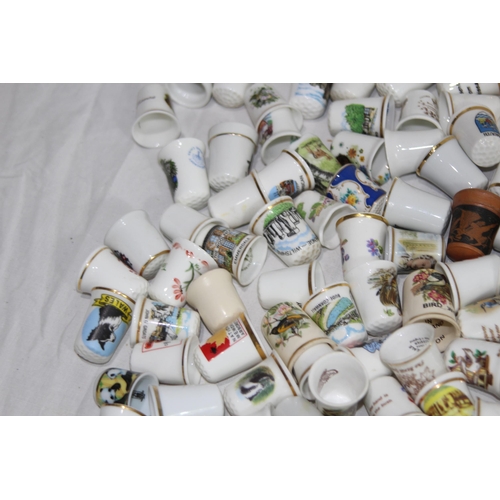 202 - COLLECTION OF OVER 600 CERAMIC, METAL AND WOODEN DECORATIVE THIMBLES