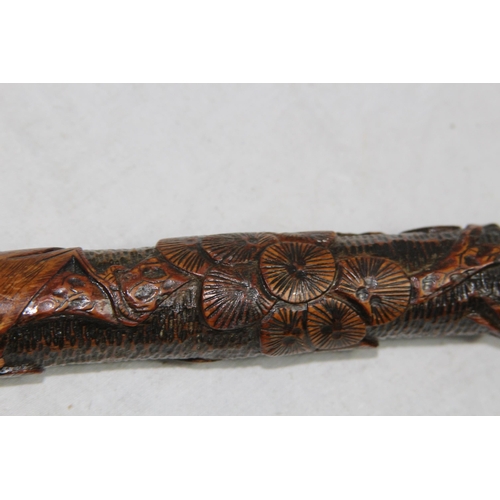 284 - LATE 19TH EARLY 20TH CENTURY CARVED ORIENTAL BAMBOO WALKING STICK
86CM