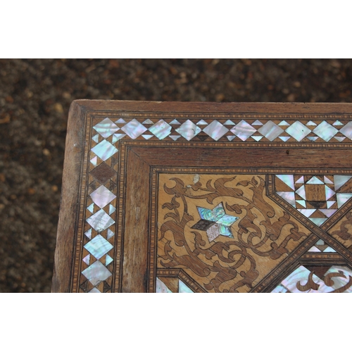 24 - MOORISH INLAID MAHOGANY OCCASIONAL TABLE WITH MOTHER OF PEARL AND MARQUETRY ARABIC SCRIPT 
45 X 64CM