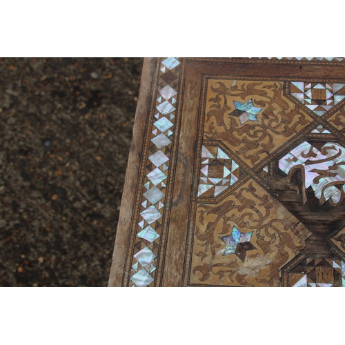 24 - MOORISH INLAID MAHOGANY OCCASIONAL TABLE WITH MOTHER OF PEARL AND MARQUETRY ARABIC SCRIPT 
45 X 64CM